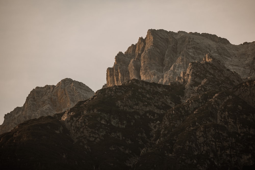 a very tall mountain with a sky in the background