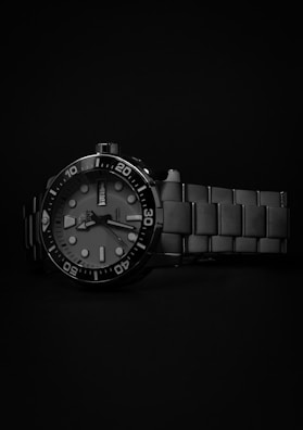 a watch is shown on a black background