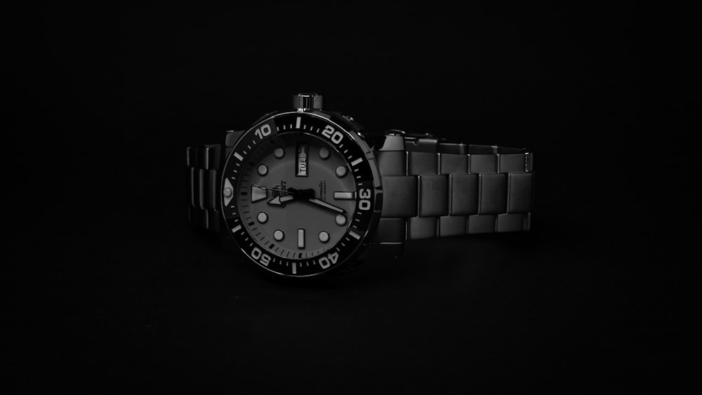 a watch is shown on a black background