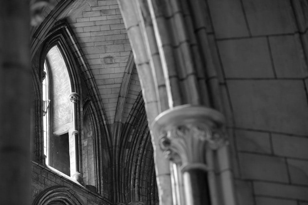 a black and white photo of a window in a building