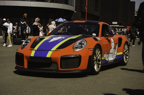 Finished vehicle wrap showcasing bold colors and sharp graphics in a busy Barcelona street.
