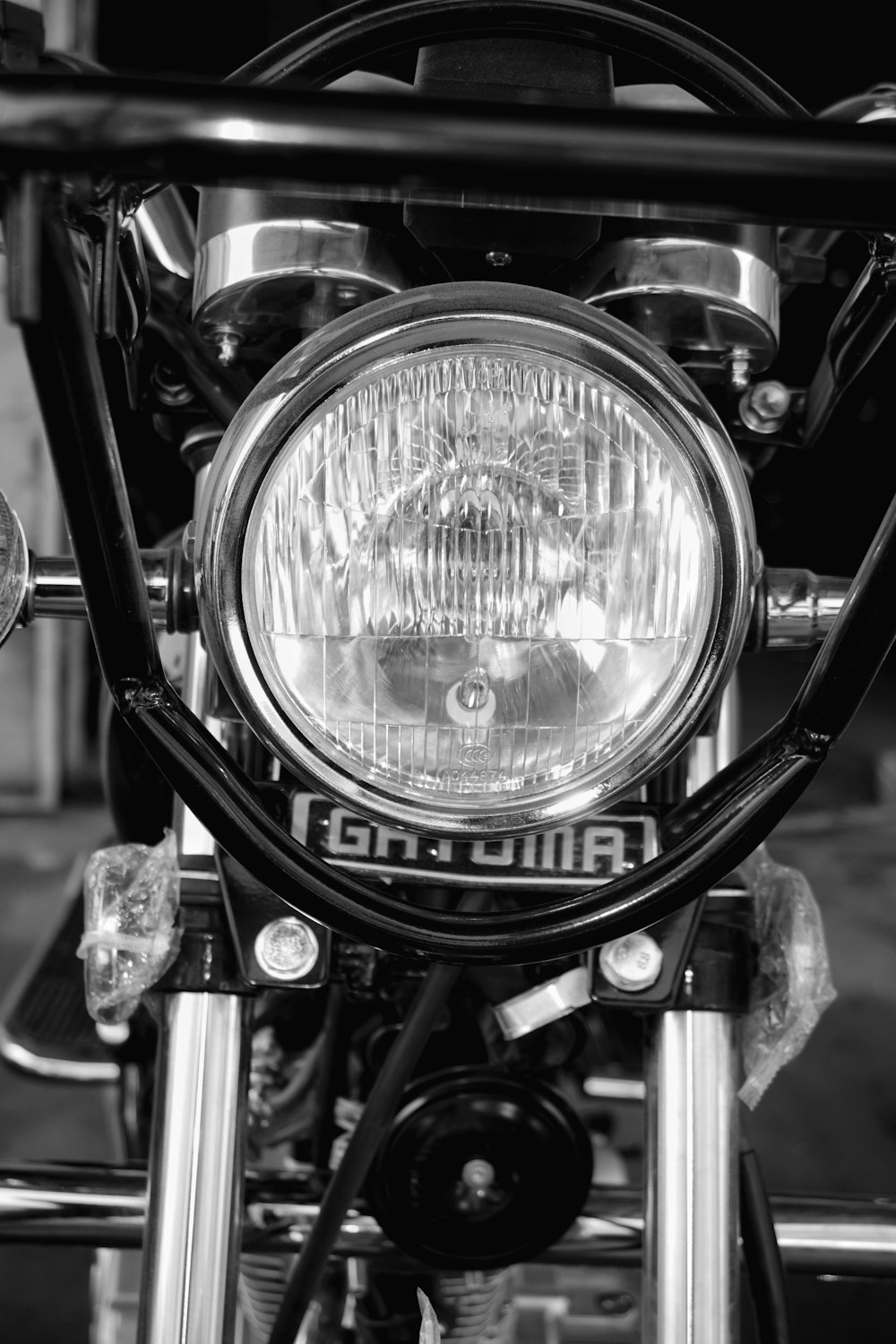 a close up of the headlight of a motorcycle