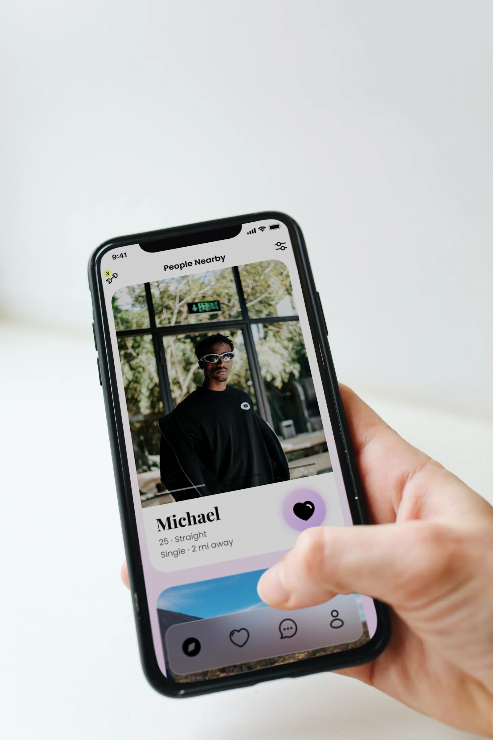 A person swiping through profiles on a dating app