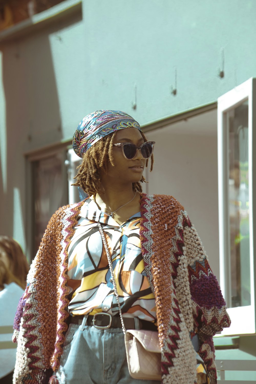 a statue of a woman wearing a scarf and sunglasses