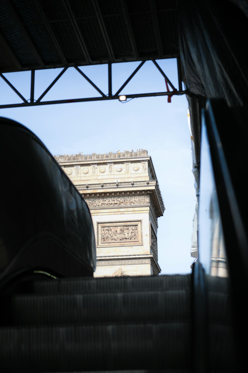 a view of the eiffel tower from a moving vehicle