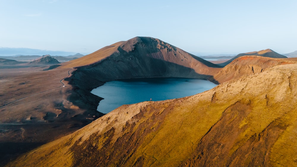 a mountain with a lake in the middle of it