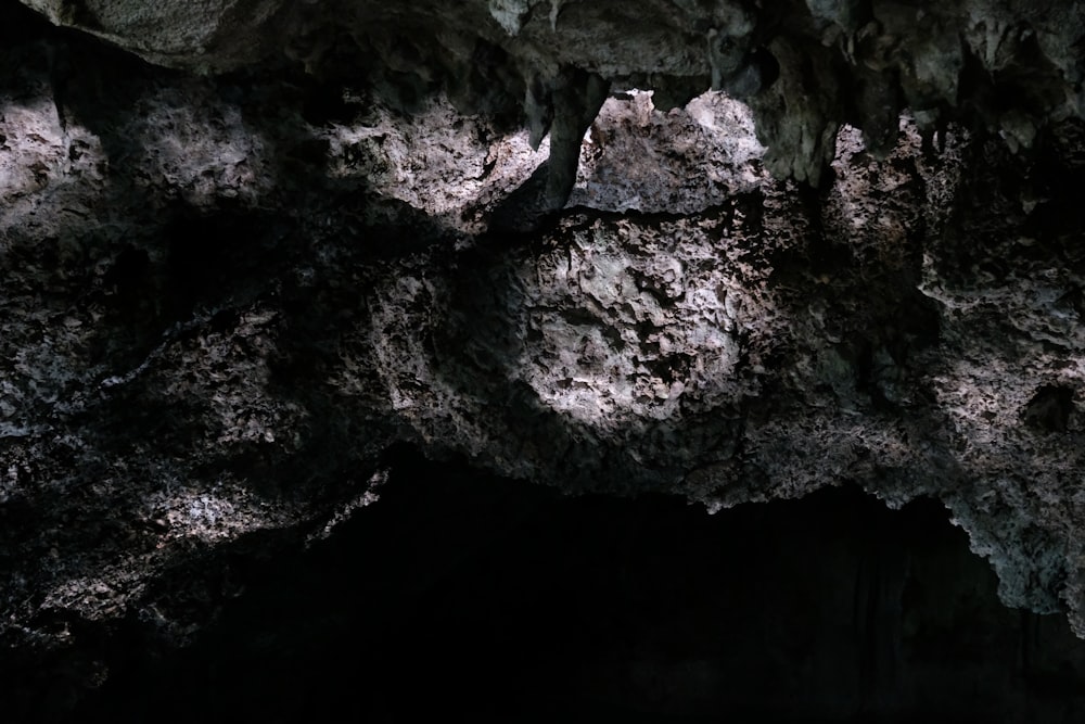 a cave filled with lots of dark rocks