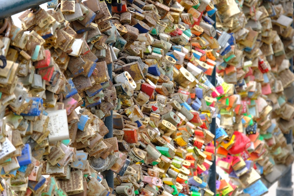 a wall covered in lots of different colored tiles