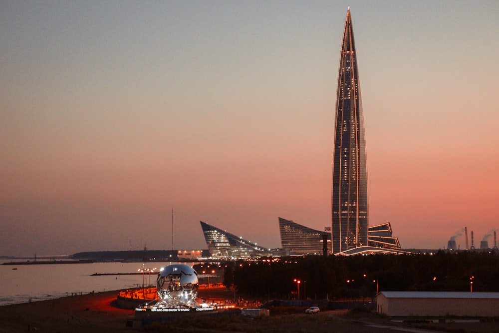 a very tall building near a body of water