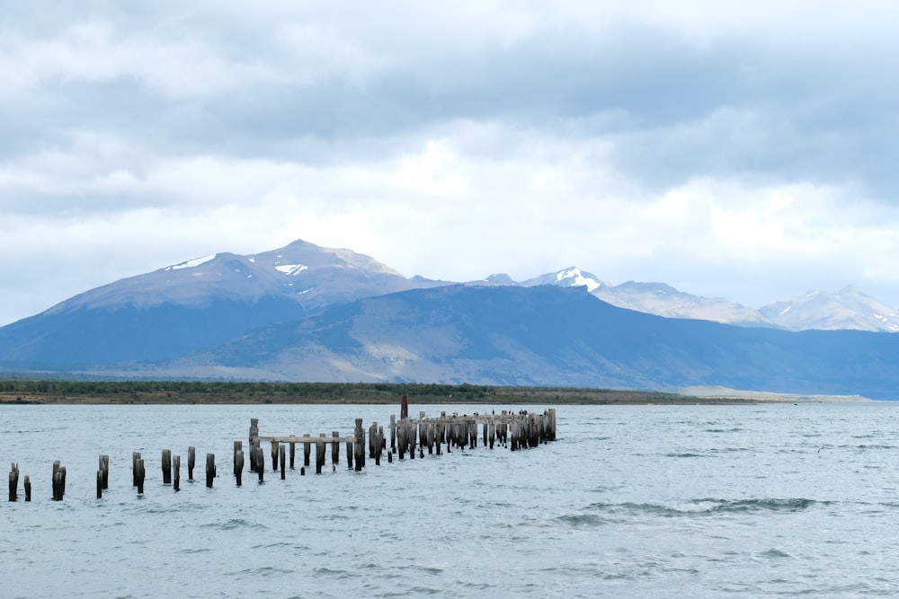 a large body of water with mountains in the background