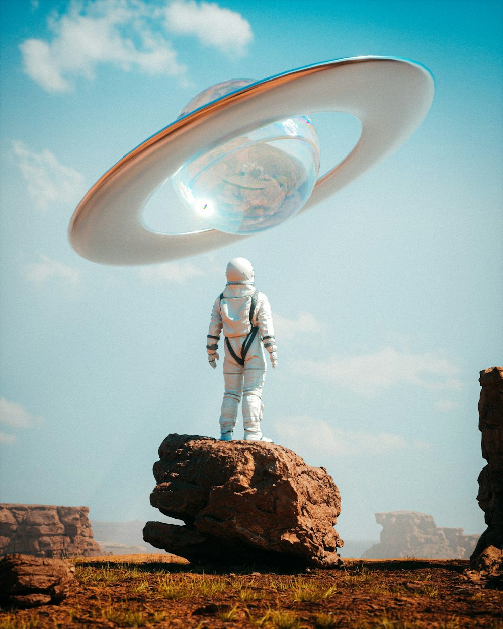 a man in a space suit standing on top of a rock