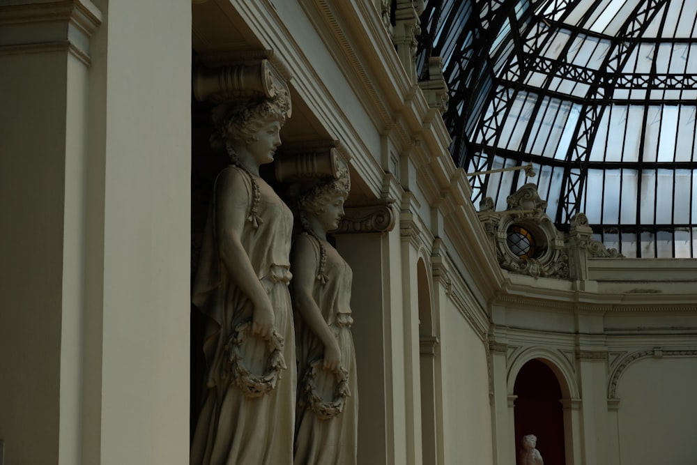 a statue of two women standing next to each other