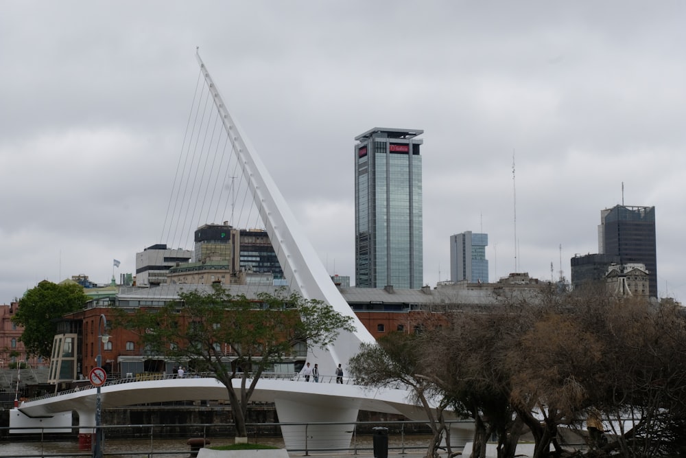a bridge with a tall building in the background
