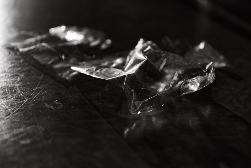 a black and white photo of ice cubes on a table