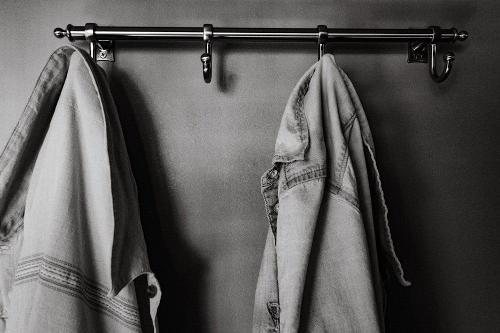 a pair of jeans hanging on a rail