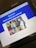 A tablet screen displaying a Ticketmaster confirmation page for a concert ticket purchase. The upper section features a blue banner with white text saying 'You're in! Here's what you ordered.' Below is a collage of colored images showing different portraits of a woman in varying styles and is associated with a concert tour. The event details below mention a tour, location, and time.