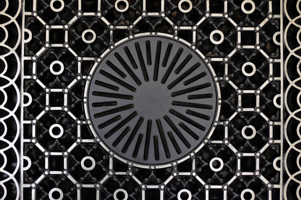 a black and white pattern with a circular design