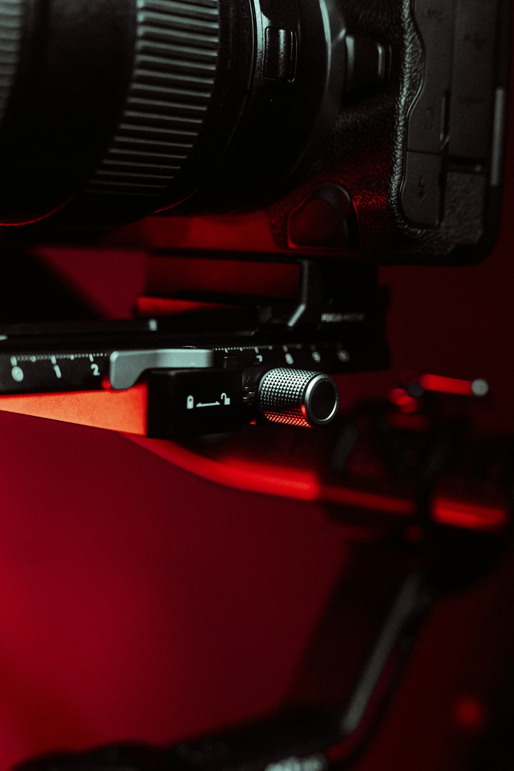 a close up of a camera on a red background