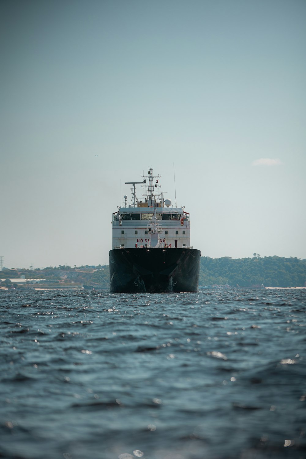 a large boat floating on top of a body of water