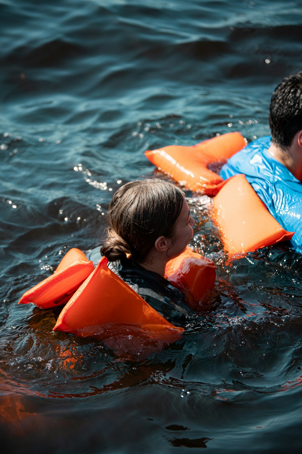 a man and a little girl are in the water