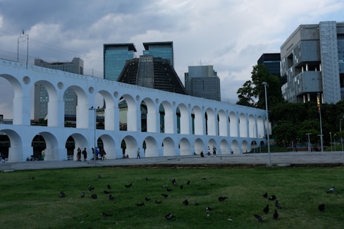 a large white building with arches and arches around it