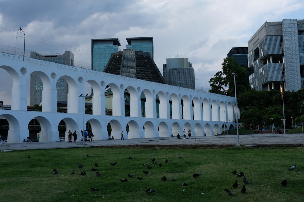 a large white building with arches and arches around it