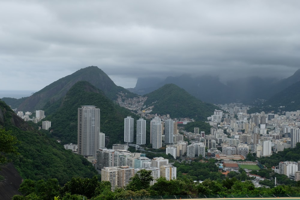 a view of a city with mountains in the background