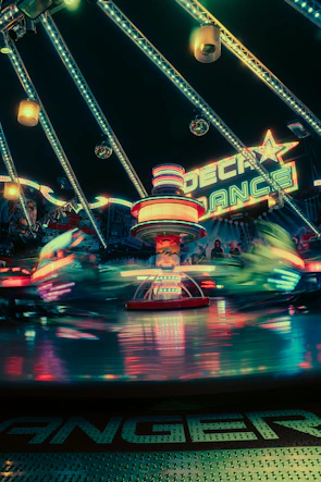 Guests spinning joyfully inside a 360 booth surrounded by vibrant lights.