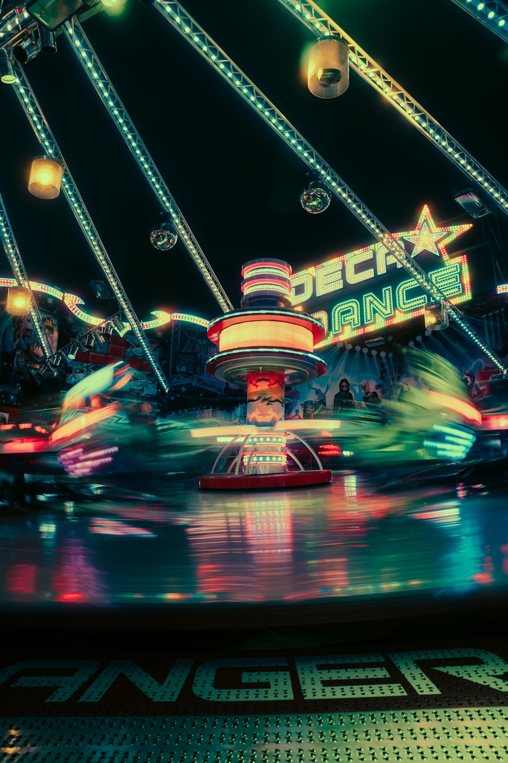 a carnival ride at night with lights on