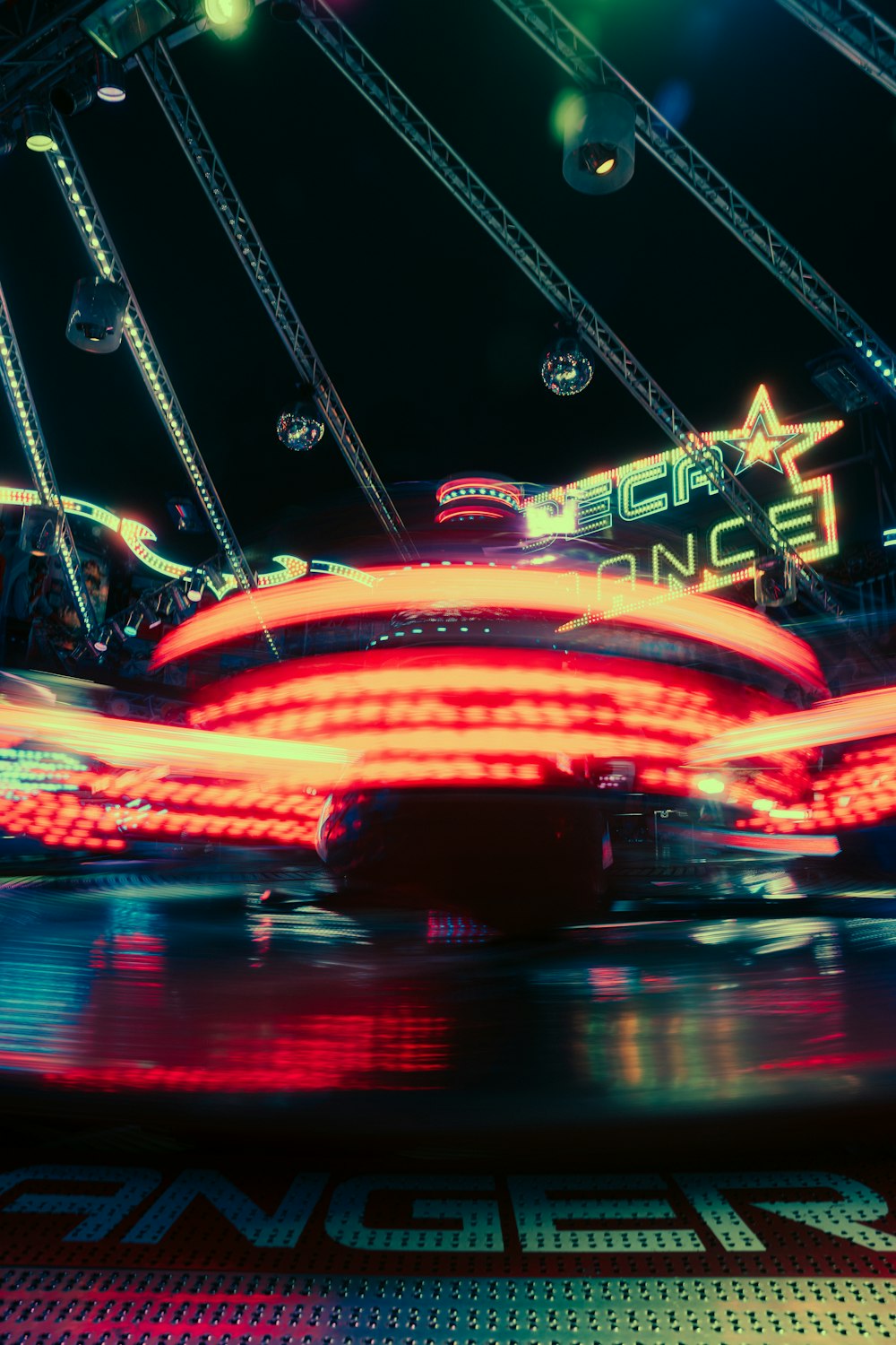 a carnival ride at night with lights on