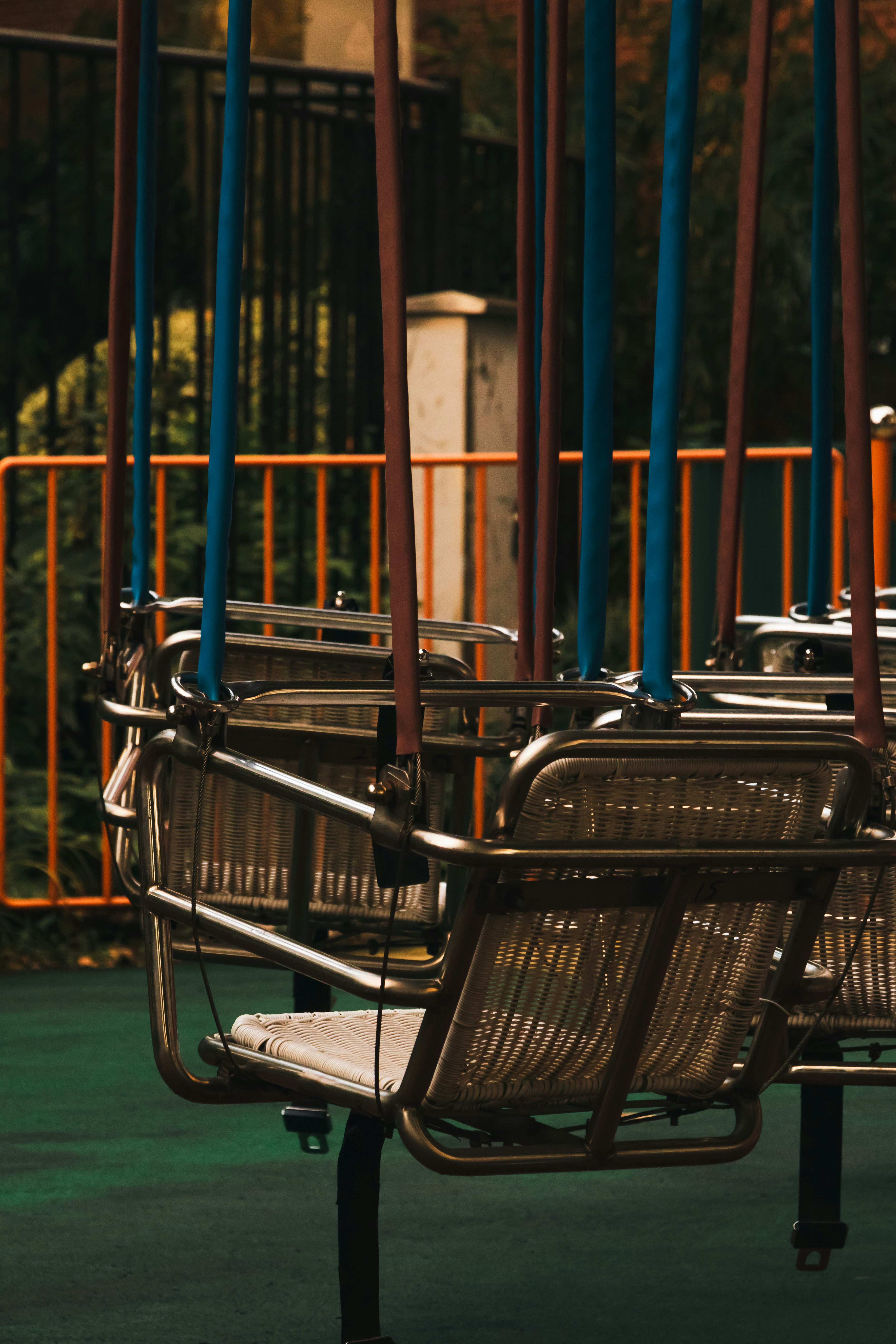 a row of chairs sitting next to each other on a playground