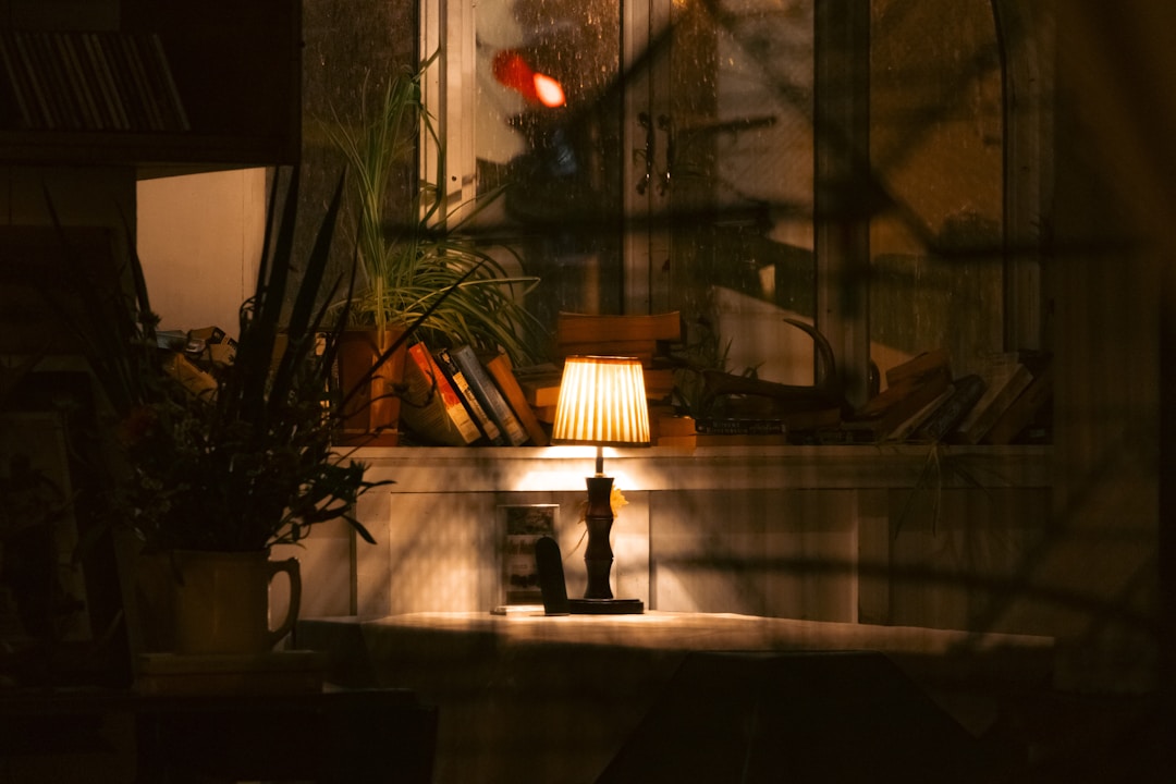 Person reading in soft evening light as part of a calming bedtime routine