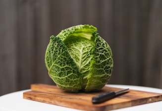 Traditional wooden tools and fresh cabbage heads ready for fermentation.