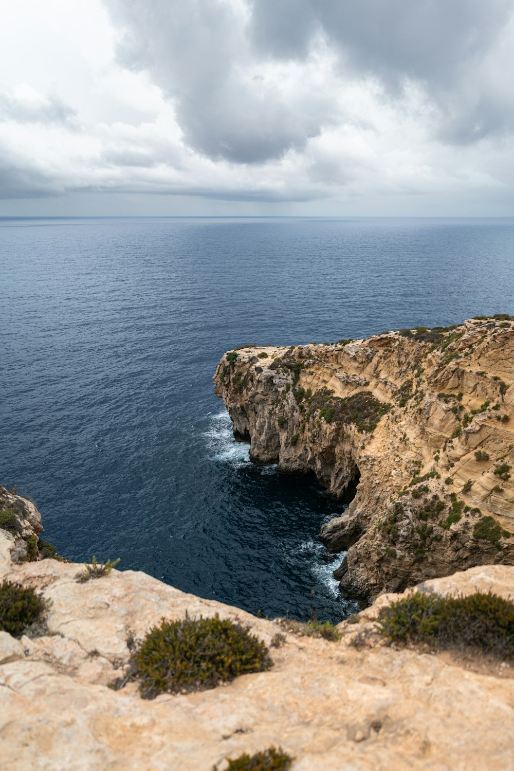 a view of a body of water from a cliff