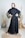 A happy customer wearing a stylish abaya.