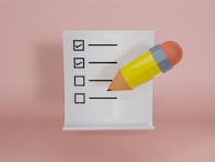 A checklist on a table with notes and a pen, representing the practical steps in the adoption process.