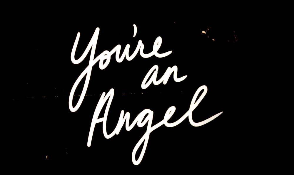 a sign that says you're an angel on it