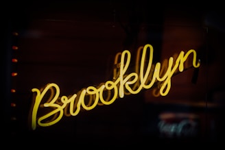 a neon sign that says brooklyn on it