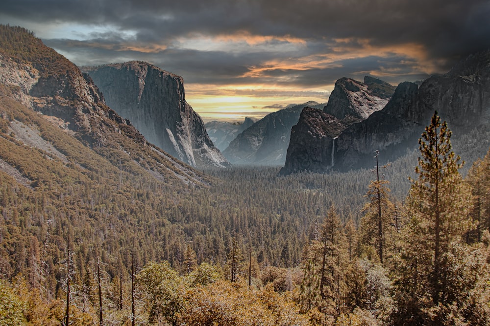 a view of a valley with mountains in the background