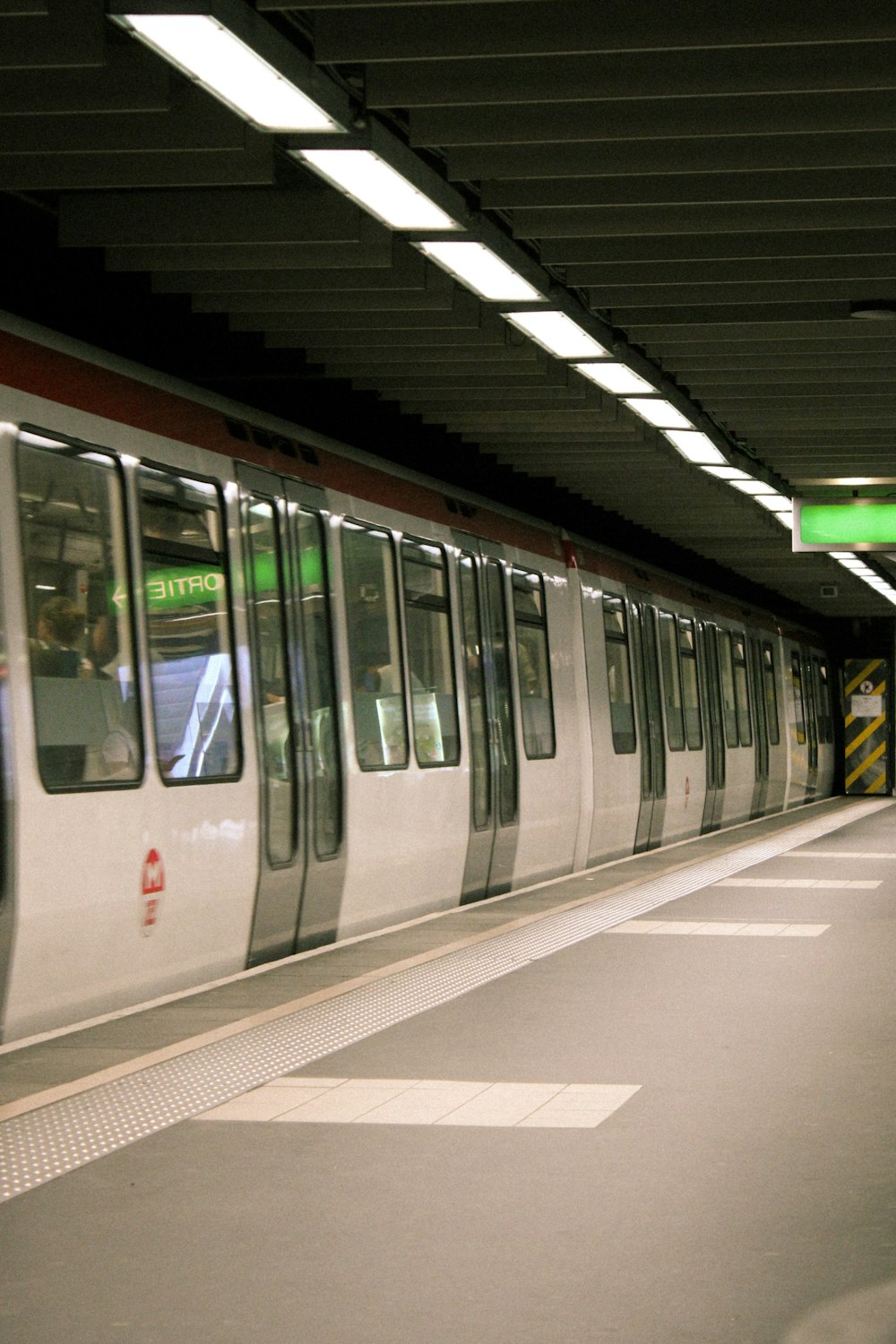 a subway train pulling into a train station