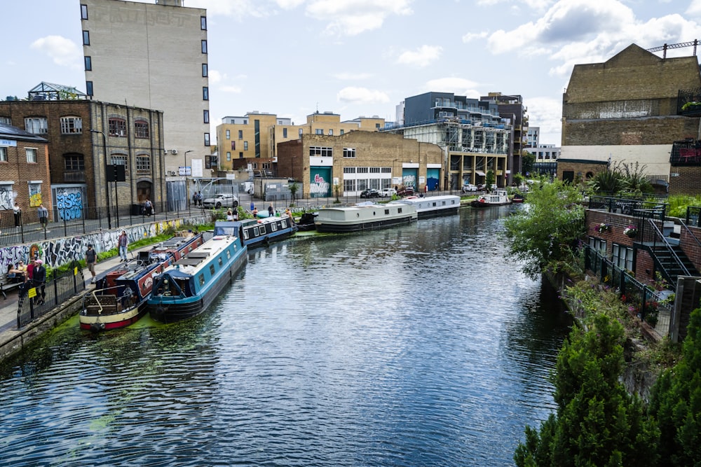 a river running through a city next to tall buildings