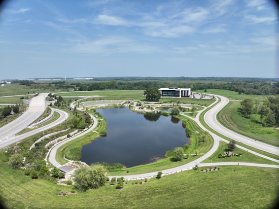 A large 10 kanal plot showcasing wide internal roads and green surroundings at npf cighu.