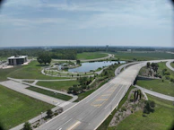 Rendered aerial view of a complex project showing landscaping and building layout.