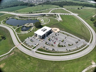 Aerial view of a corporate campus with parking, walkways, and landscaped areas.