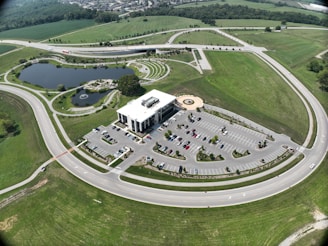 An aerial view of a well-maintained hospital campus surrounded by greenery.