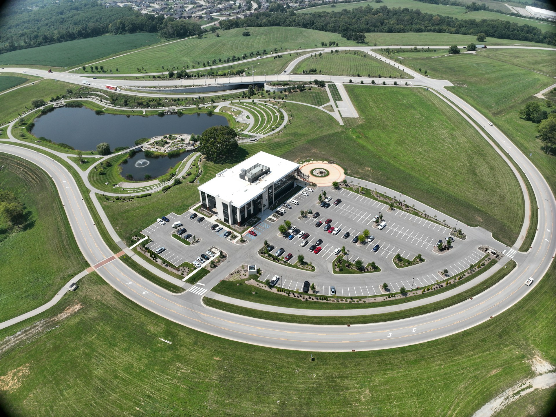 An aerial shot capturing the scale of a build-and-lease IT infrastructure project with multiple interconnected buildings and ample parking.