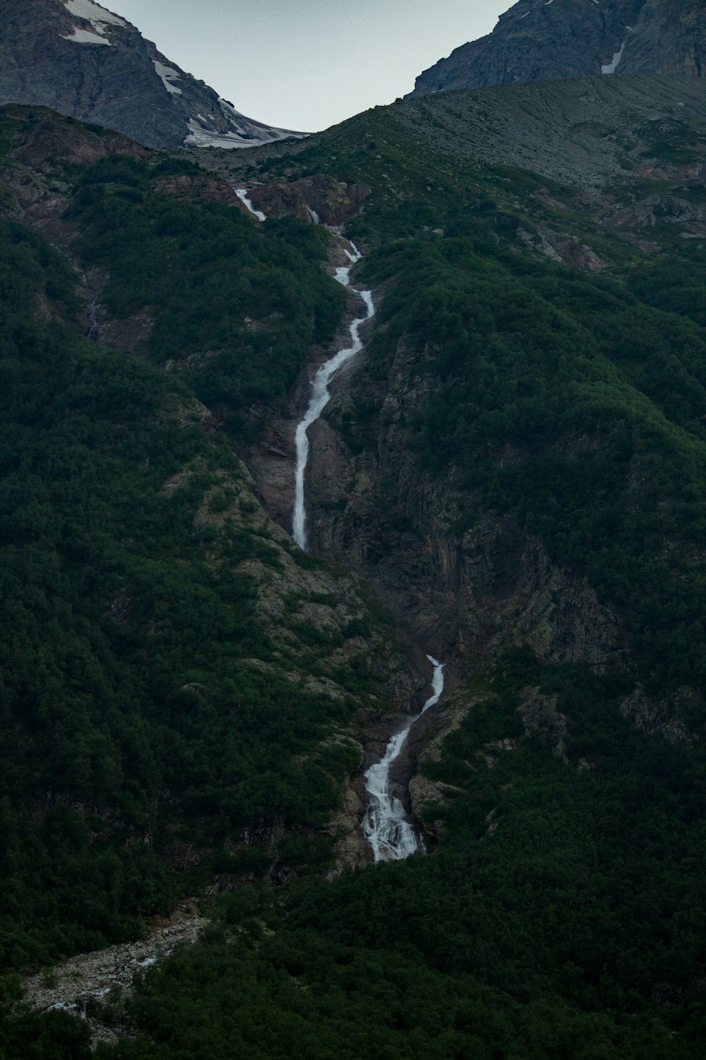 a mountain with a river running through it