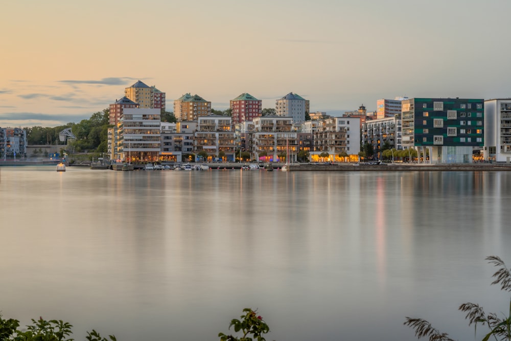 a large body of water with a city in the background