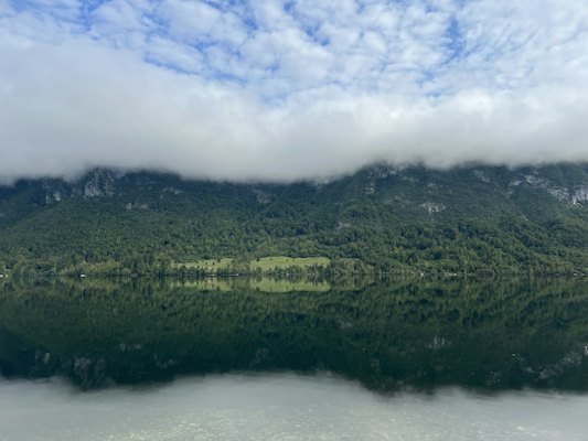 A large body of water surrounded by mountains — Lake Bohinj, Slovenia