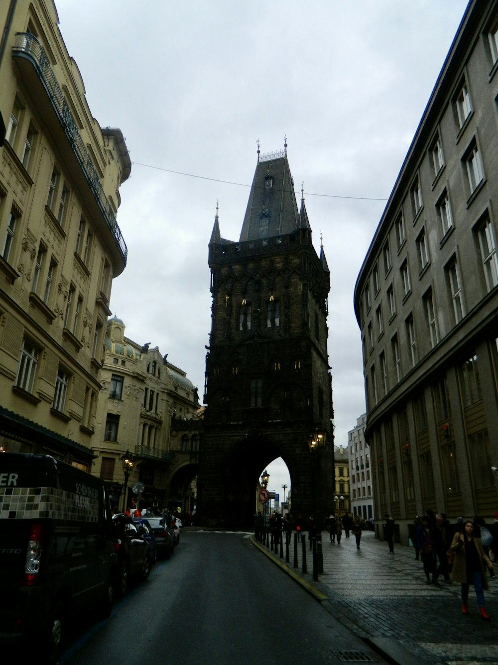 a very tall clock tower towering over a city